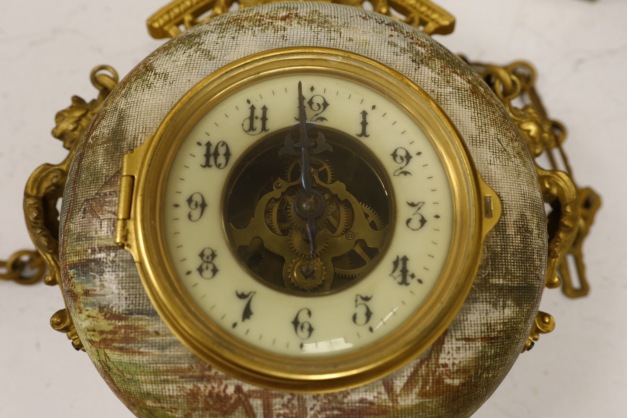 A late 19th century French ornate ceramic and gilt brass wall clock, 35cm tall